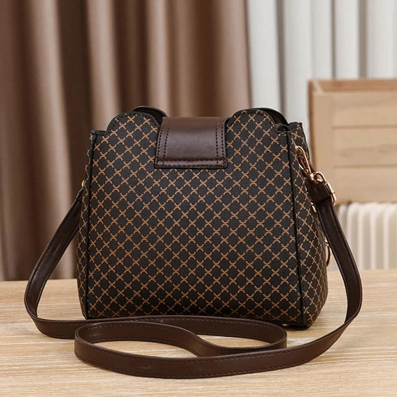 Monogram Flip Clasp Bucket Crossbody - VELLEGRA