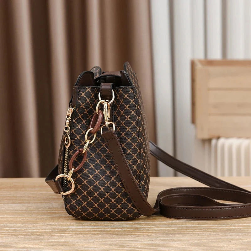 Monogram Flip Clasp Bucket Crossbody - VELLEGRA