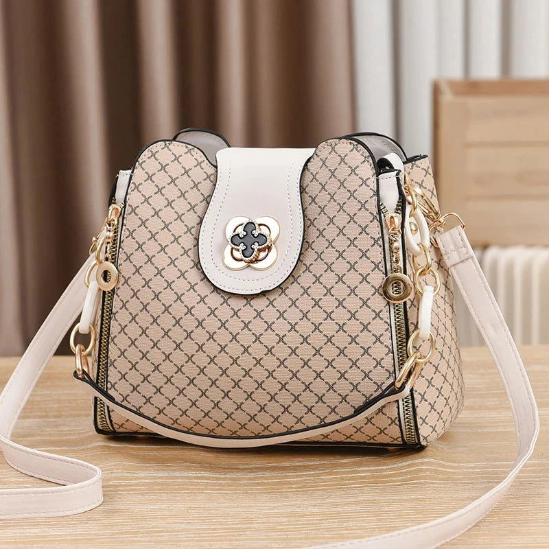 Monogram Flip Clasp Bucket Crossbody - VELLEGRA