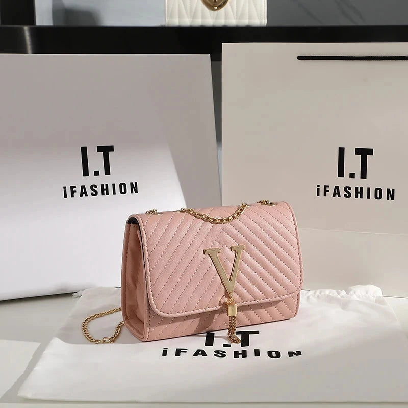 Quilted V-Tassel Chain Clutch - VELLEGRA
