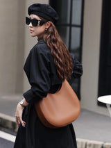 Solène Arc Sculpted Leather Crescent Bag