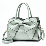 Bellavue Gloss Bow Handbag – Chic Patent Leather Shoulder Bag