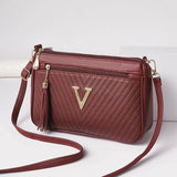 Valette Tassel Zip Crossbody - Vellegra