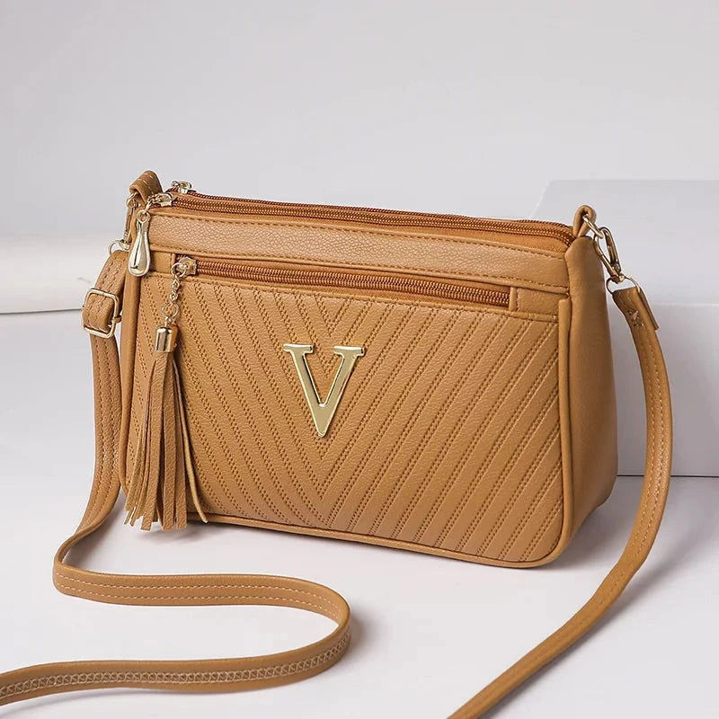 Valette Tassel Zip Crossbody - Vellegra